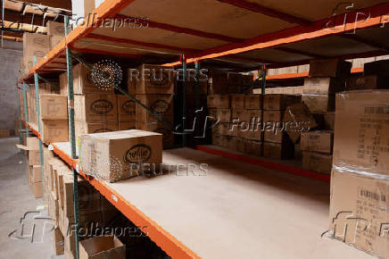 Shelves sit partially empty at the headquarters of toy manufacturer Huntar Company Inc in Union City