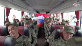 Russian soldiers sit a bus in Belarus after release from Ukraine on the third day of POW exchange