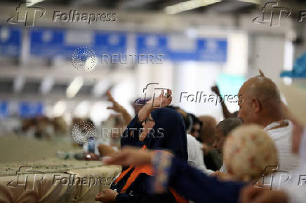 Muslim pilgrims hurl stones during 'stoning of the devil' ritual, in Mina
