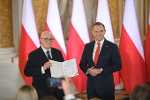 Polish President-elect Karol Nawrocki receives the winning certificate