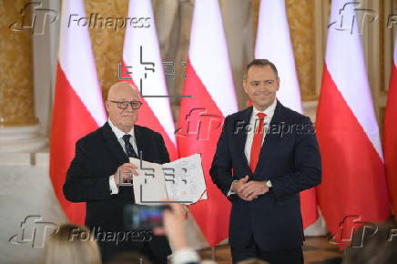 Polish President-elect Karol Nawrocki receives the winning certificate