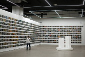 A visitor looks at artwork ?106B Depot Road Singapore 102106? by Heman Chong at the Singapore Art Museum in Singapore
