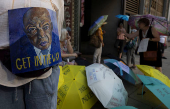 Demonstrators gather during a 