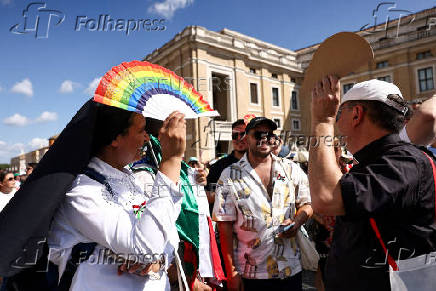LGBTQ+ pilgrims walk toward St. Peter's Basilica