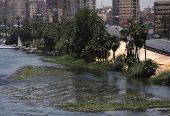 A general view of a new bridge on the bank of River Nile in front of crowded residential buildings, in Cairo