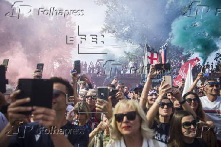 Players of Bologna FC and fans celebrate in Bologna