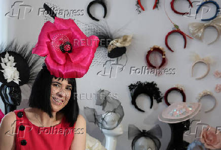 Milliner Merve Bayindir wears one of her hat creations as she speaks to Reuters ahead of the Ascot horse racing festival, in London