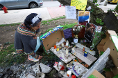 Tributes at place where Colombian Senator Uribe was shot during campaign event, in Bogota