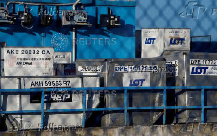 FILE PHOTO: A Polish Airlines LOT cargo containers are seen at the Chopin International Airport in Warsaw