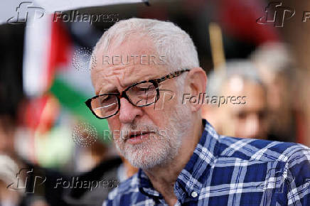 FILE PHOTO: People protest demanding a ceasefire in Gaza during a march, in London