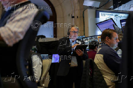 Traders work on the floorat the New York Stock Exchange (NYSE) in New York City
