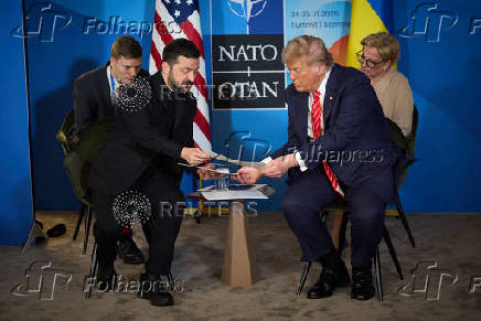 FILE PHOTO: U.S. President Trump and Ukraine's President Zelenskiy attend a meeting on the sidelines of NATO summit in The Hague