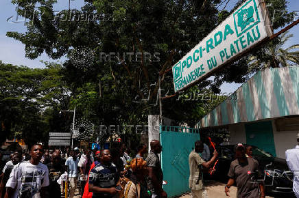 Partisans of PDCI (Democratic Party of Cote d'Ivoire) protest at their headquarters in Abidjan