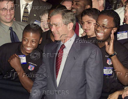 FILE PHOTO: US PRESIDENT GEORGE W BUSH POSES WITH JOB CORPS VOLUNTEERS AT LABOR DEPARTMENT SUMMIT.