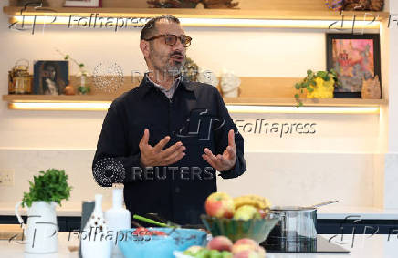 Palestinian-British chef Tamimi reacts during  interview with Reuters at his home in London