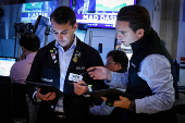 Traders work on the floor of the NYSE in New York