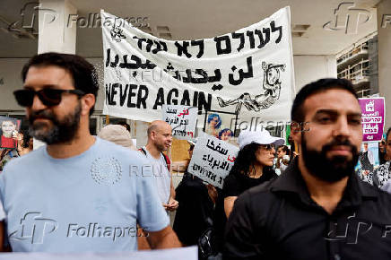 People take part in a protest against what organizers call 