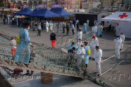 Rescued migrants disembark Sea-Watch 5 ship in Salerno
