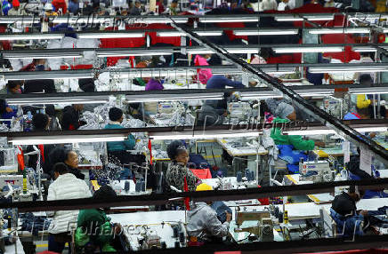Workers perfom their duties at Quantum apparel factory on the outskirts of Maseru