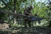 Member of the National Police Special Purpose Battalion prepares an unmanned aerial vehicle for reconnaissance flight on a front line in Zaporizhzhia Region
