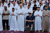 Palestinians from Gaza attend Eid al-Adha prayers, at Al Thumama Complex,  in Doha