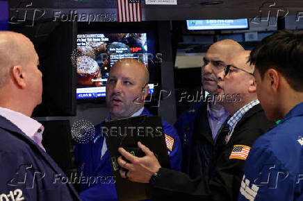 Traders work on the floor of the NYSE in New York