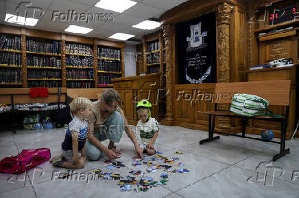 Israeli family stays in a bomb shelter, in Haifa