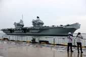 Britain's HMS Prince of Wales aircraft carrier arrives at Marina Bay Cruise Centre in Singapore