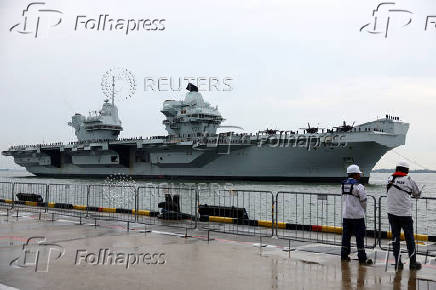 Britain's HMS Prince of Wales aircraft carrier arrives at Marina Bay Cruise Centre in Singapore