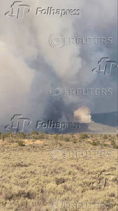 Smoke billows as the White Sage Fire burns, in Fredonia