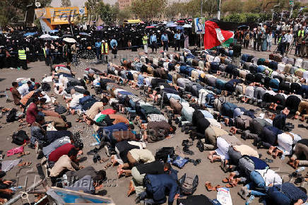 University students and professors perform prayers to ask for rain in Sanaa