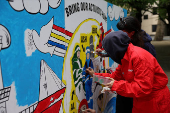 Greenpeace paints mural outside South Korea Embassy