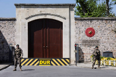 Military personnel stand guard outside the Turkish Presidency's Dolmabahce working office, in Istanbul