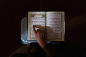 Student reads the Koran at a madrasa in Multan