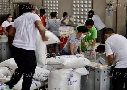 President Ferdinand Marcos visits a relief goods warehouse in Manila as Tropical Storm 'Crising apporaches