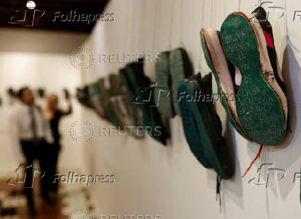 Relatives of missing persons attend an exhibition called