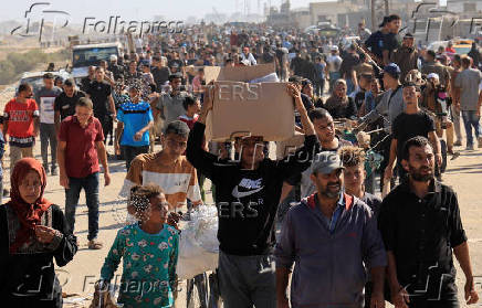 Palestinians seeking aid gather near an aid distribution site run by the U.S.-backed Gaza Humanitarian Foundation, in Rafah