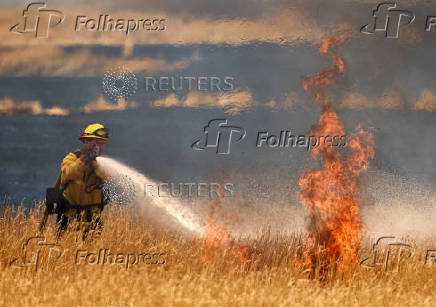 A firefighter battles flames in Woodland California