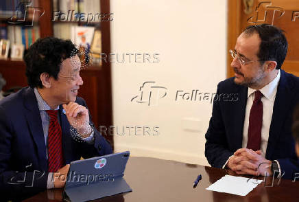 Cypriot President Nikos Christodoulides and Qu Dongyu, Director-General of the Food and Agriculture Organization of the United Nations (FAO) talk during a meeting at the Presidential Palace in Nicosia
