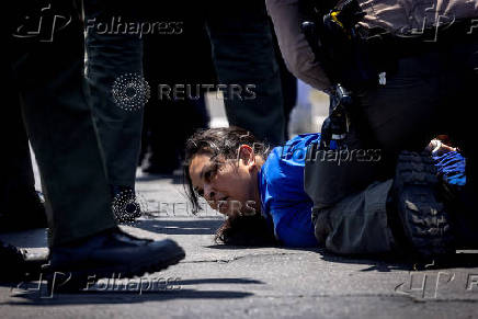 Standoff by protesters and law enforcement, following multiple detentions by ICE in Los Angeles County