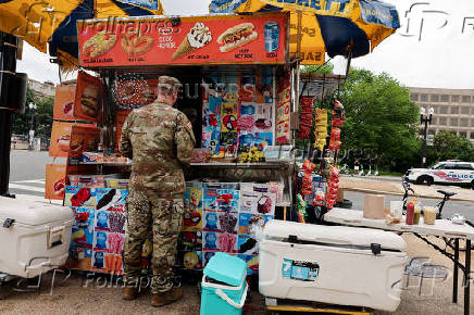 People gather ahead of the military parade to commemorate the U.S. Army's 250th Birthday in Washington