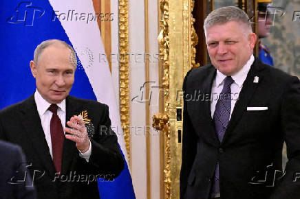 FILE PHOTO: Russian President Vladimir Putin meets with Slovak Prime Minister Robert Fico at the Kremlin in Moscow
