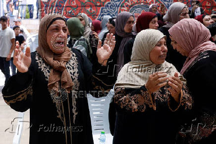 Mourners take part in the funeral of Mohammad Al-Shalabi, near Ramallah