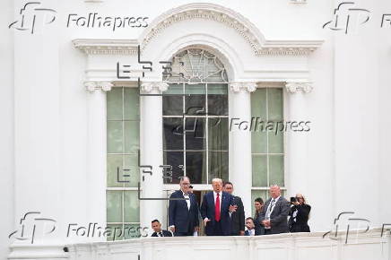 US President Trump walks on roof of the West Wing of the White House