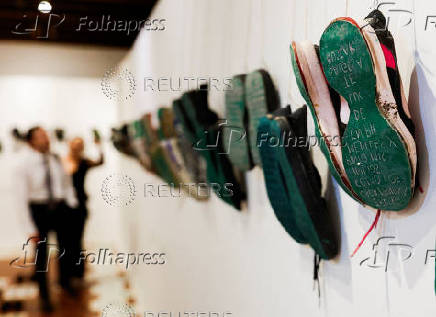 Relatives of missing persons attend an exhibition called 