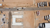 A drone view shows buses carrying Iranian pilgrims at the Arar border crossing