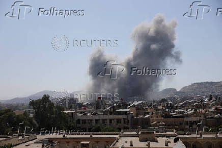 Smoke rises after strikes on Syria's defense ministry in Damascus