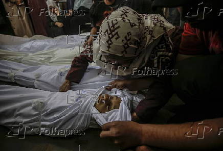 Palestinians mourn family killed in Israeli airstrike on Gaza refugee camp