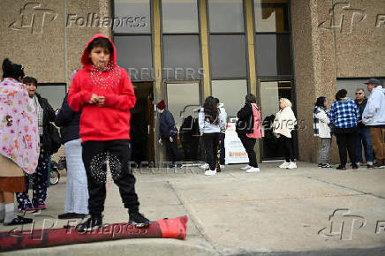 People wait in line outside Adams County Emergency Food Bank, weeks into the continuing U.S. government shutdown, in Commerce City