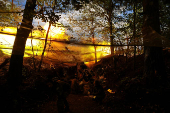 Ukrainian servicemen fire a self-propelled howitzer towards Russian troops at a frontline near the town of Chasiv Yar